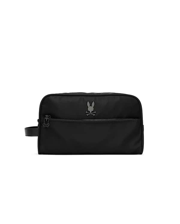 Black Mens Nylon Dopp Kit with a smooth nylon texture, featuring a prominent gunmetal Psycho Bunny skull logo on the front, a zippered front pocket, and a wrist strap with a smaller logo on the zipper pull. (4)