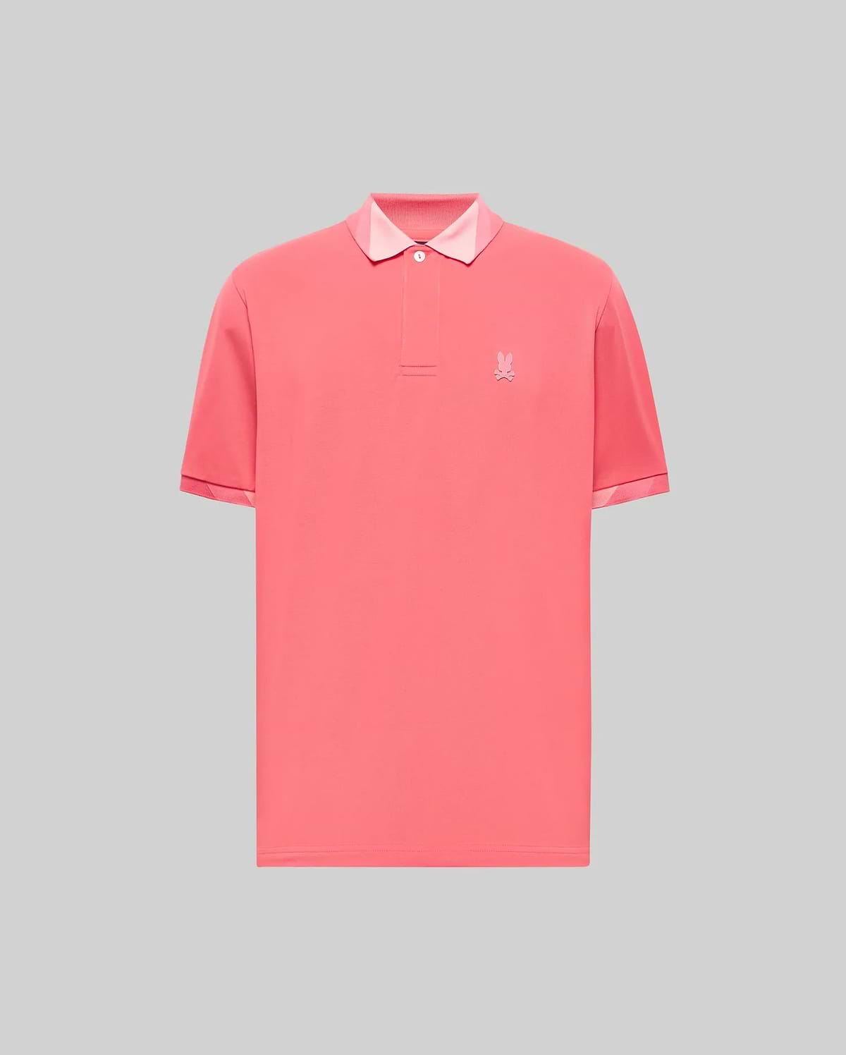 Vibrant coral jersey Mens Onyx Sport Polo with a classic fit, two-button placket, light pink contrast collar lining, and a tonal embroidered Psycho Bunny skull logo on the left chest.