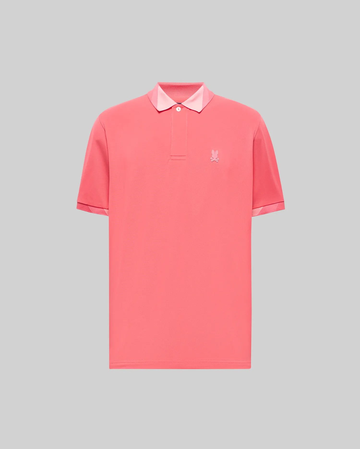 Vibrant coral jersey Mens Onyx Sport Polo with a classic fit, two-button placket, light pink contrast collar lining, and a tonal embroidered Psycho Bunny skull logo on the left chest.