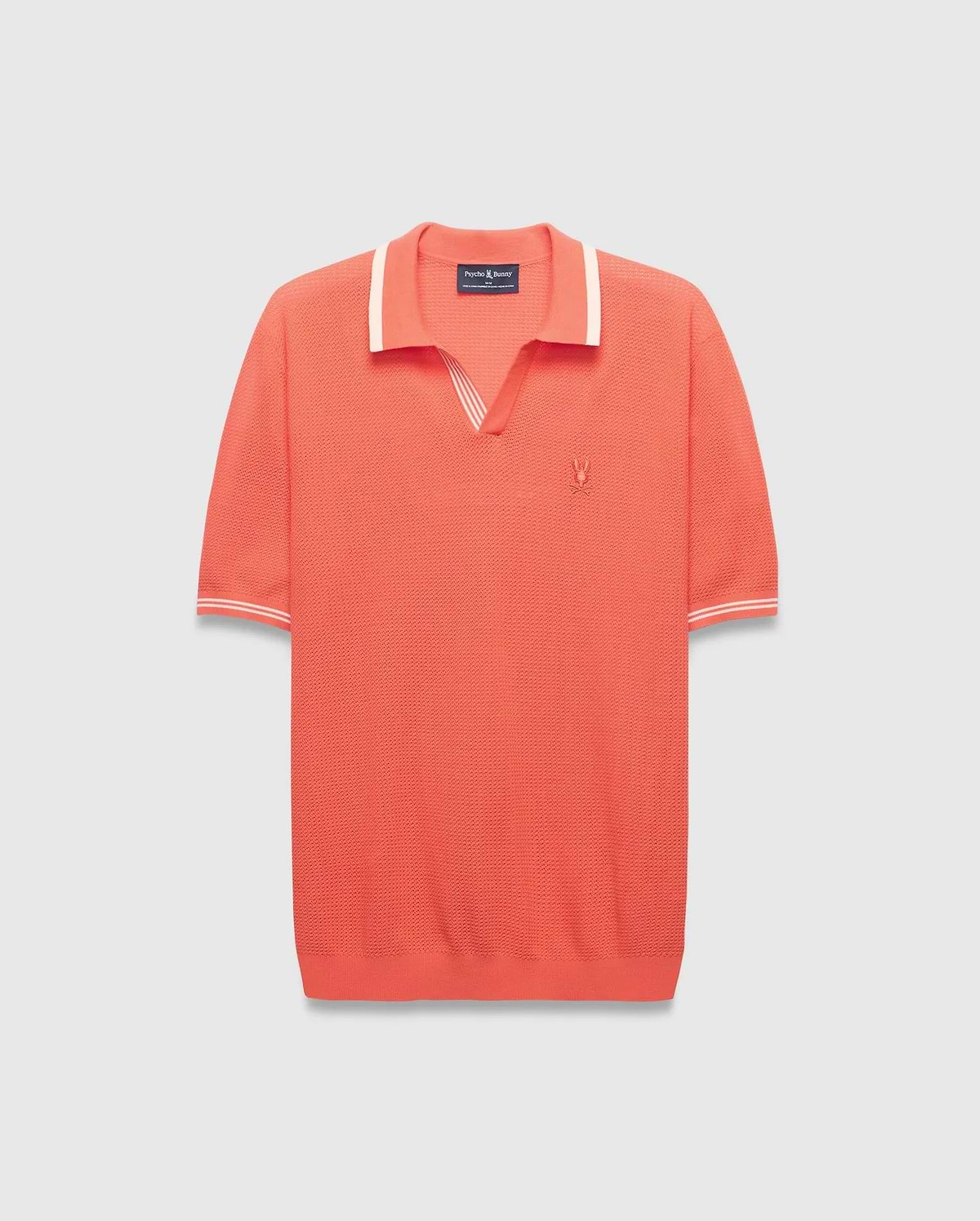 Mens Innis Polo, a vibrant coral knit polo with a V-neck collar and cuffs accented by white stripes, featuring a small embroidered Psycho Bunny skull logo on the left chest. Classic fit. (4)