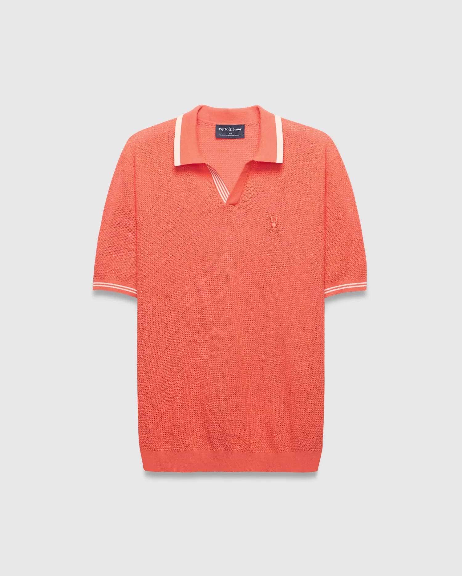 Mens Innis Polo, a vibrant coral knit polo with a V-neck collar and cuffs accented by white stripes, featuring a small embroidered Psycho Bunny skull logo on the left chest. Classic fit. (4)