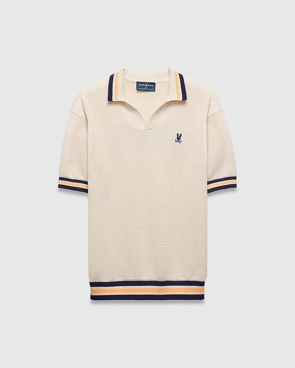 Mens Theros Knit Polo, cream textured knit with a relaxed fit, featuring a V-neck, navy and orange striped ribbed collar, cuffs, and hem, and a small embroidered navy Psycho Bunny skull logo on the left chest.