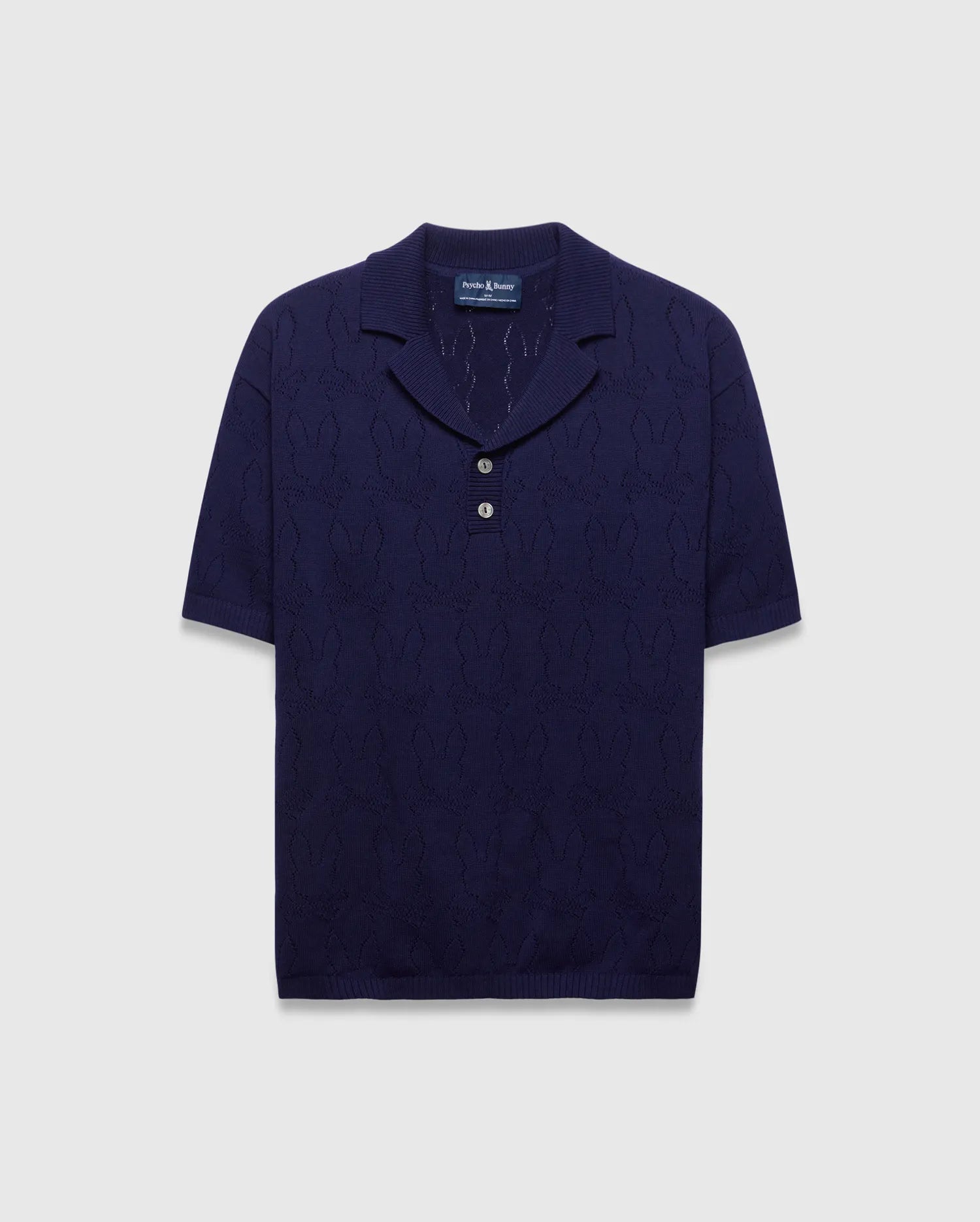 Mens Harold Pointelle All Over Bunny Knit Polo in navy, featuring a classic fit, open collar, two silver buttons, and an all-over pointelle bunny skull pattern.