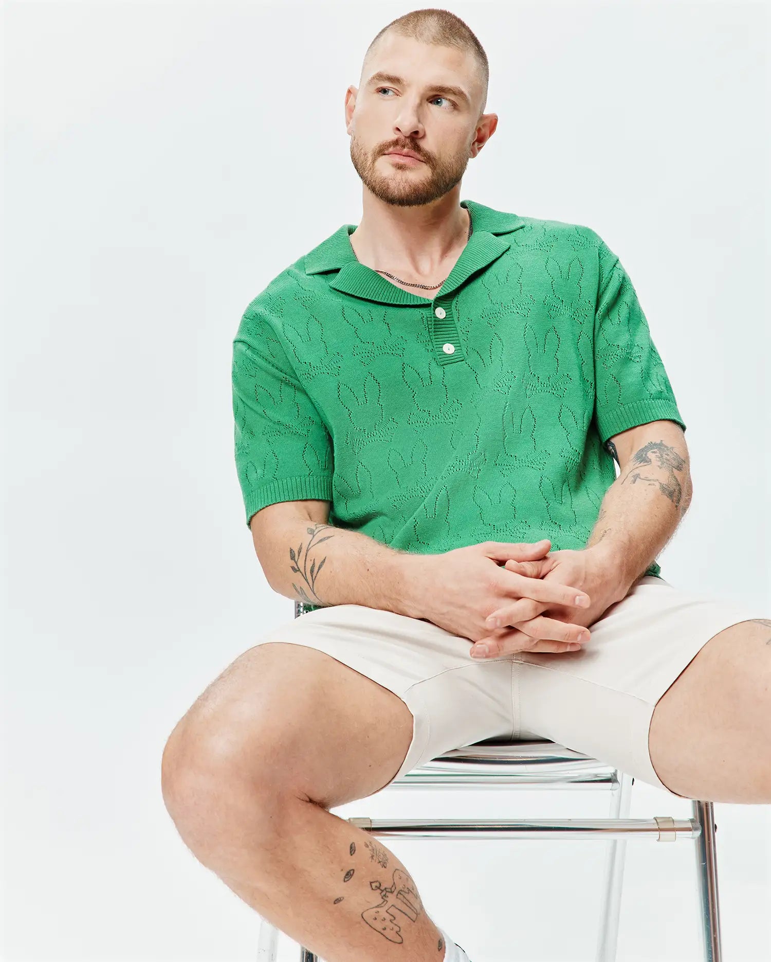 Mens Harold Pointelle All Over Bunny Knit Polo, a vibrant green knit polo with a classic fit, featuring an all-over pointelle bunny pattern and white button placket.