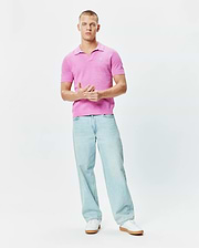 Bright Pink Mens Devon Knit Polo featuring a textured knit fabric, classic fit, open collar, and a small white embroidered Psycho Bunny skull logo on the left chest.