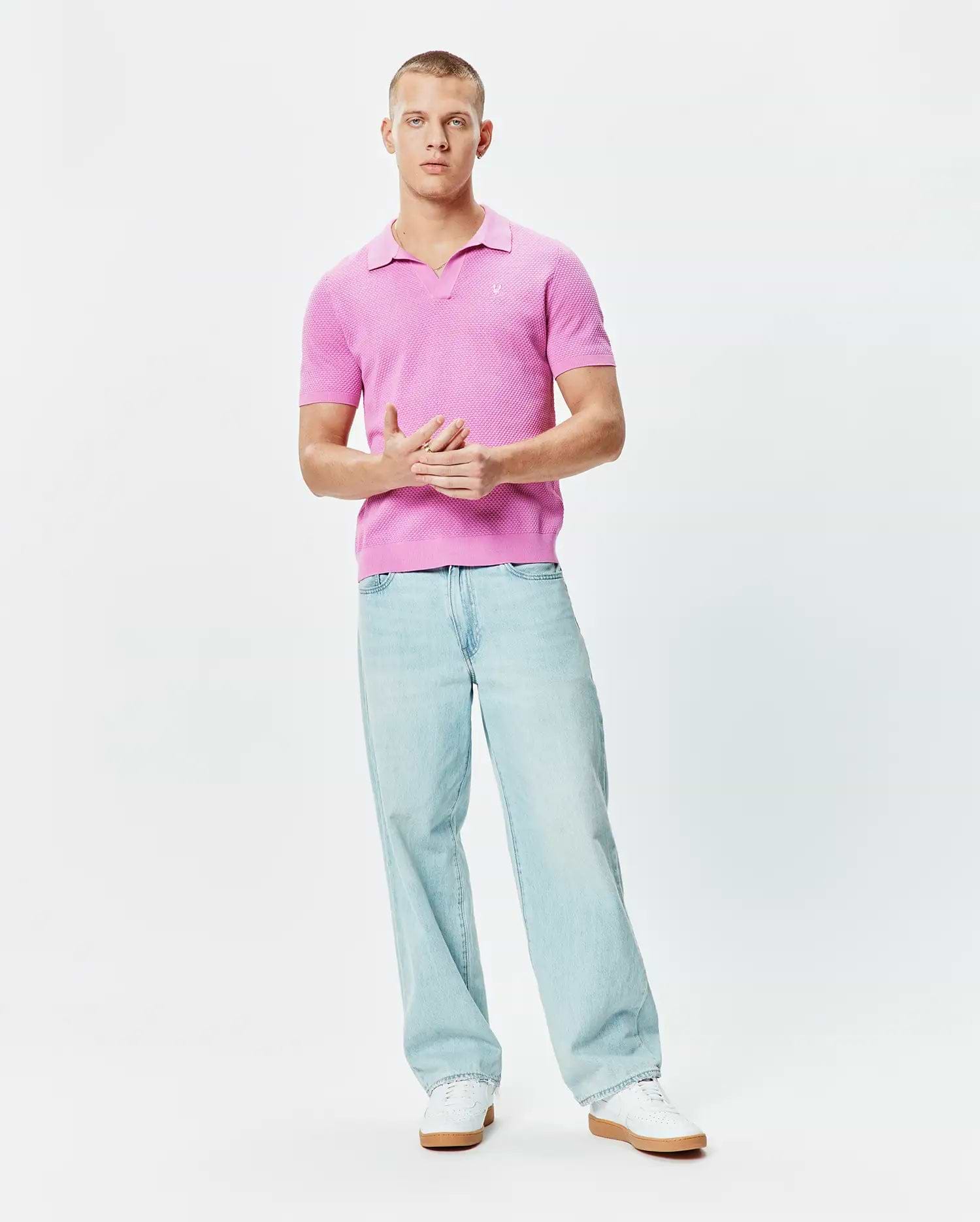 Bright Pink Mens Devon Knit Polo featuring a textured knit fabric, classic fit, open collar, and a small white embroidered Psycho Bunny skull logo on the left chest.