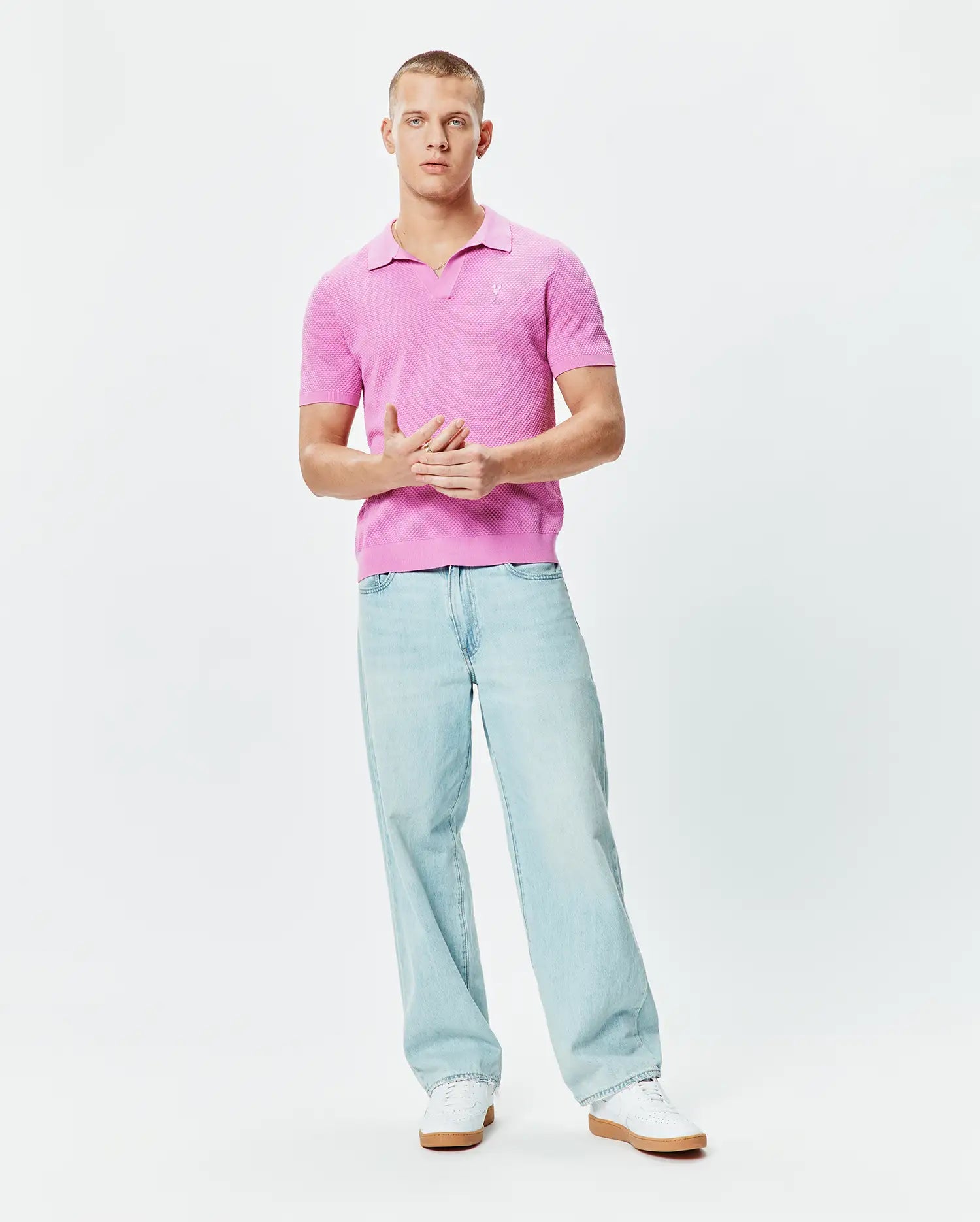 Bright Pink Mens Devon Knit Polo featuring a textured knit fabric, classic fit, open collar, and a small white embroidered Psycho Bunny skull logo on the left chest.