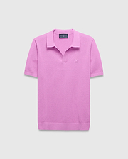Mens Devon Knit Polo in vibrant pink, featuring a textured knit fabric, classic fit, V-neck placket, and a small tonal embroidered Psycho Bunny skull logo on the left chest.