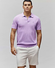 Mens Devon Knit Polo in lavender, featuring a textured knit fabric, classic fit, open collar, and a small embroidered Psycho Bunny skull logo on the left chest.