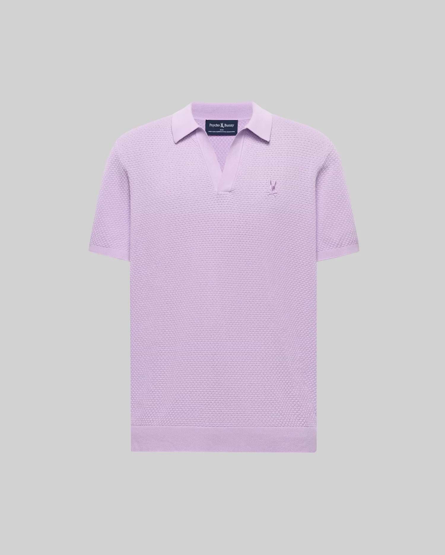Mens Devon Knit Polo in lavender, featuring a textured knit fabric, open V-neck collar, and a small embroidered Psycho Bunny skull logo on the left chest.