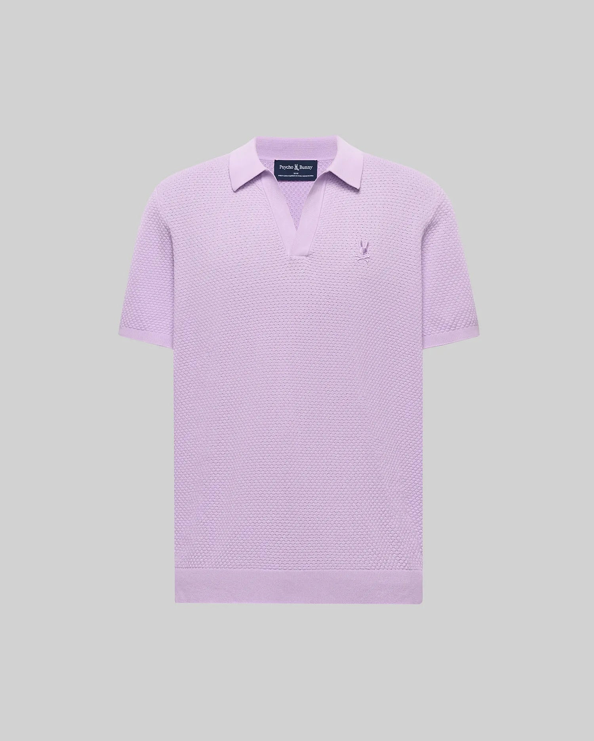 Mens Devon Knit Polo in lavender, featuring a textured knit fabric, open V-neck collar, and a small embroidered Psycho Bunny skull logo on the left chest.