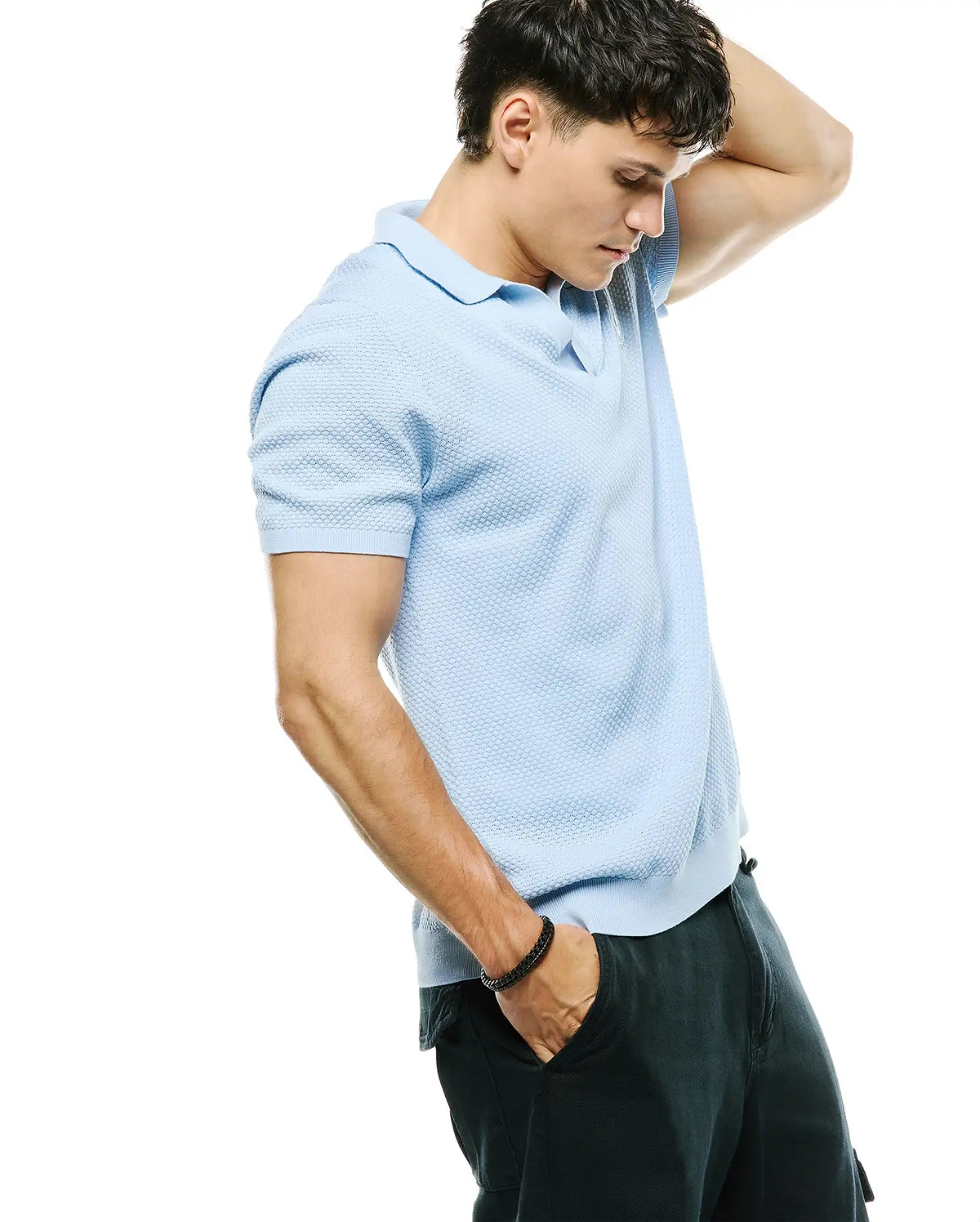 Mens Devon Bubble Stitch Knit Polo in vibrant light blue, with a classic fit, unique bubble stitch texture, and the iconic small embroidered Psycho Bunny skull logo on the left chest.