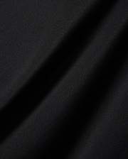 MENS EDWIN SPORT POLO in premium black pique fabric, featuring a classic fit and the signature embroidered Psycho Bunny skull logo on the chest, embodying refined streetwear style.