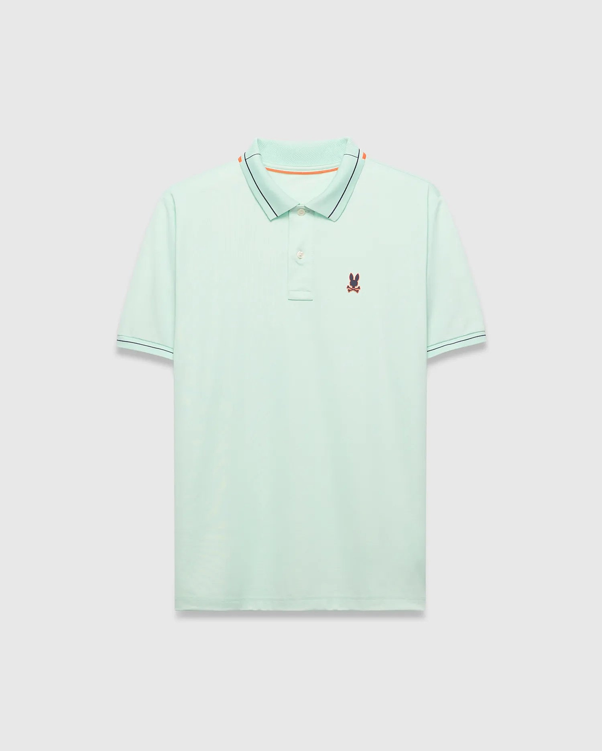 Mens Edwin Sport Polo, a classic fit light green pique polo with a black and orange striped collar, matching black striped cuffs, and a small embroidered Psycho Bunny skull logo on the left chest.