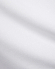 Mens Edwin Sport Polo, a premium white pique fabric, showcasing its refined textured weave. This high-quality material is characteristic of Psycho Bunny's sophisticated streetwear.