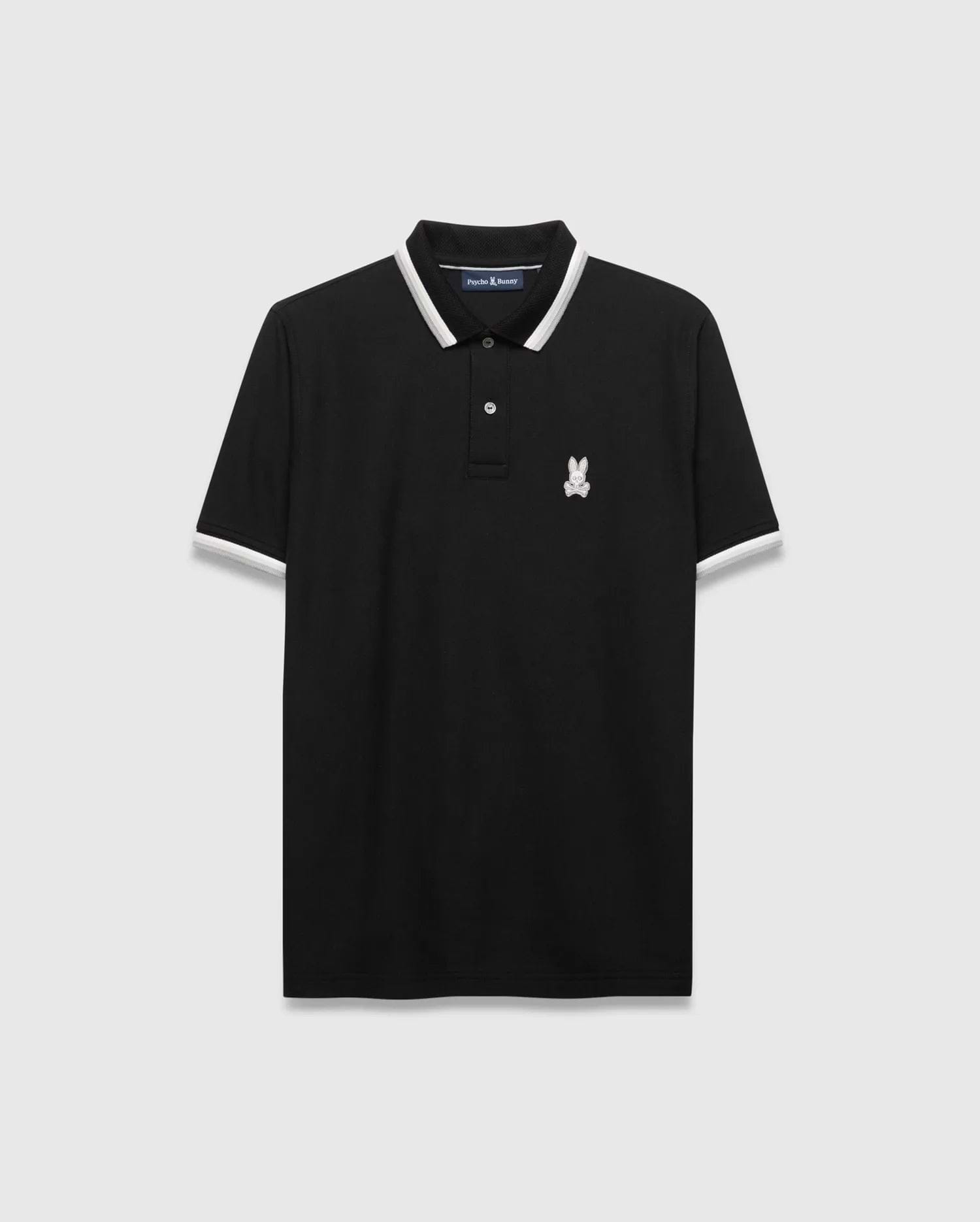 Mens Holden Pique Polo, a classic fit black pique polo shirt with white and grey striped collar and cuffs, featuring a small embroidered white Psycho Bunny skull logo on the left chest.