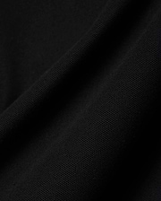 Close-up of the rich black pique fabric for the Mens Holden Pique Polo, highlighting its refined, textured weave and premium quality, characteristic of Psycho Bunny's sophisticated streetwear.
