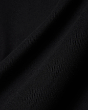 Close-up of the rich black pique fabric for the Mens Holden Pique Polo, highlighting its refined, textured weave and premium quality, characteristic of Psycho Bunny's sophisticated streetwear.