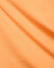 Premium Mens Holden Pique Polo by Psycho Bunny, featuring a bright peach-orange hue and finely woven, classic textured pique fabric with elegant diagonal folds.
