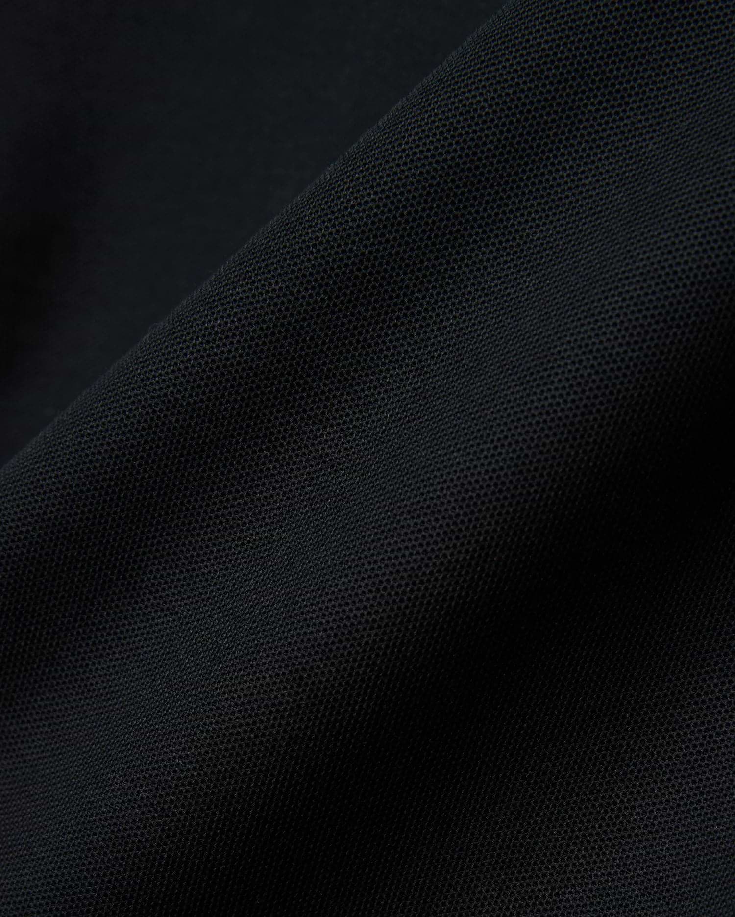 Black MENS NATE PIQUE POLO, a classic fit staple, featuring a refined textured pique weave and the iconic small embroidered Psycho Bunny skull logo on the left chest.