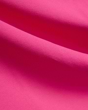 Vibrant fuchsia MENS NATE PIQUE POLO fabric, showcasing its classic textured pique knit weave, embodying Psycho Bunny's bold and refined streetwear style.
