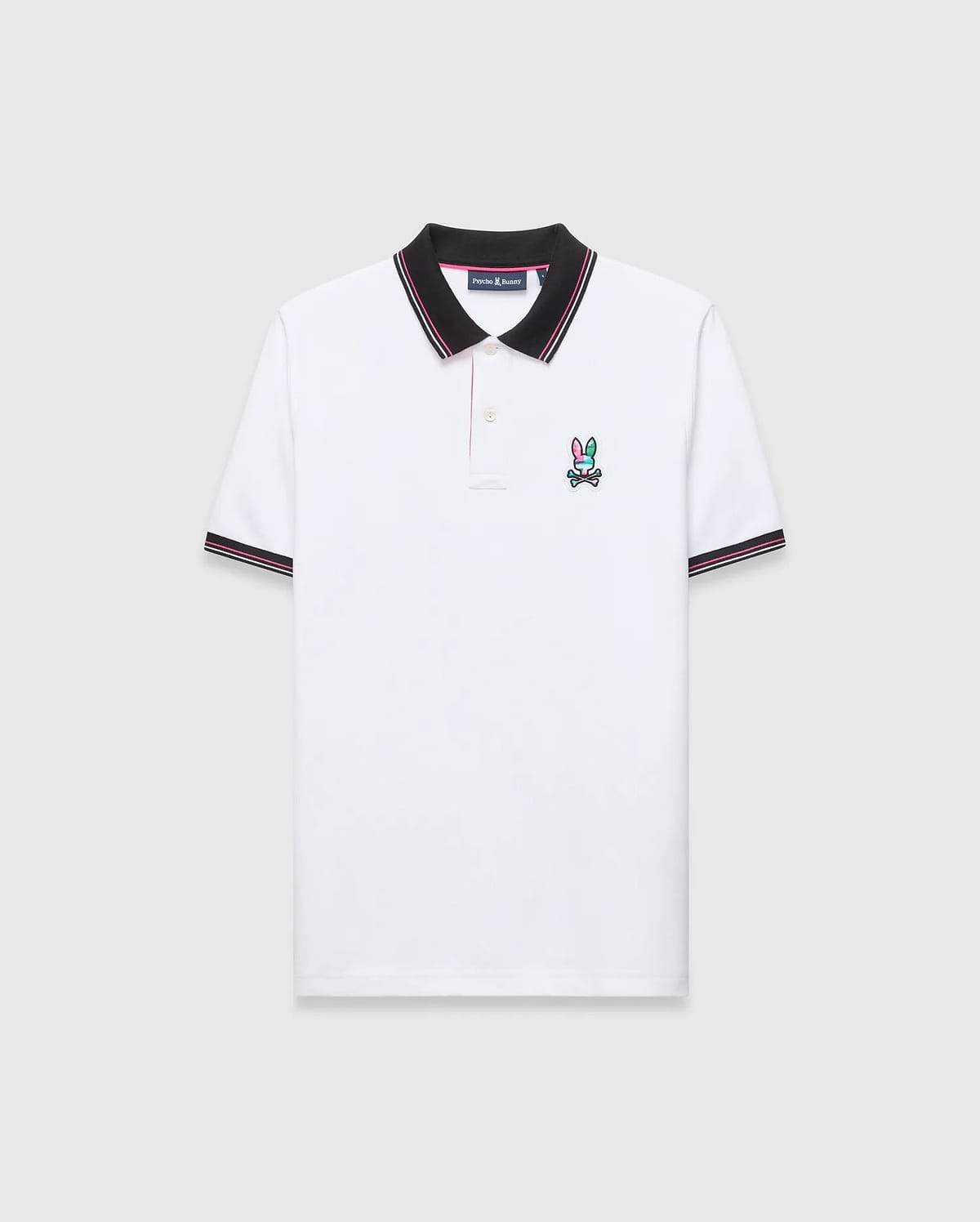 Mens Nate Pique Polo, classic fit, white pique fabric with a black ribbed collar and cuffs with pink/white stripes. A small, embroidered pink, teal, and black Psycho Bunny skull logo on the left chest.