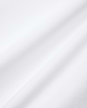 Mens Nate Pique Polo in crisp white, showcasing its premium, breathable, and finely textured pique fabric with subtle diagonal folds, embodying Psycho Bunny's refined streetwear aesthetic.