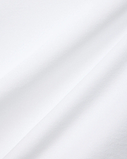Mens Nate Pique Polo in crisp white, showcasing its premium, breathable, and finely textured pique fabric with subtle diagonal folds, embodying Psycho Bunny's refined streetwear aesthetic.