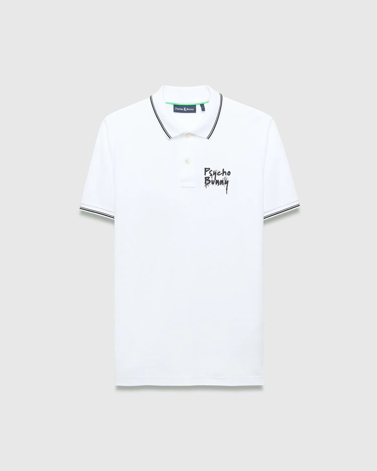 Mens Duncan Pique Polo, white classic fit pique polo with black striped collar and cuffs, featuring a distressed black Psycho Bunny text logo embroidered on the left chest and green neck tape.