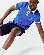 Mens Ridley Pique Polo in royal blue pique fabric, featuring a classic fit, white collar, white striped placket, white striped sleeve cuffs, and an embroidered white Psycho Bunny skull logo on the left chest.