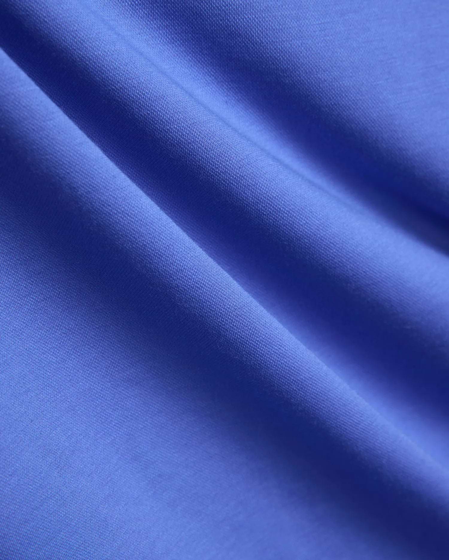 Mens Ridley Pique Polo in a vibrant royal blue, showcasing its refined, breathable pique knit fabric texture, embodying Psycho Bunny's premium streetwear style.