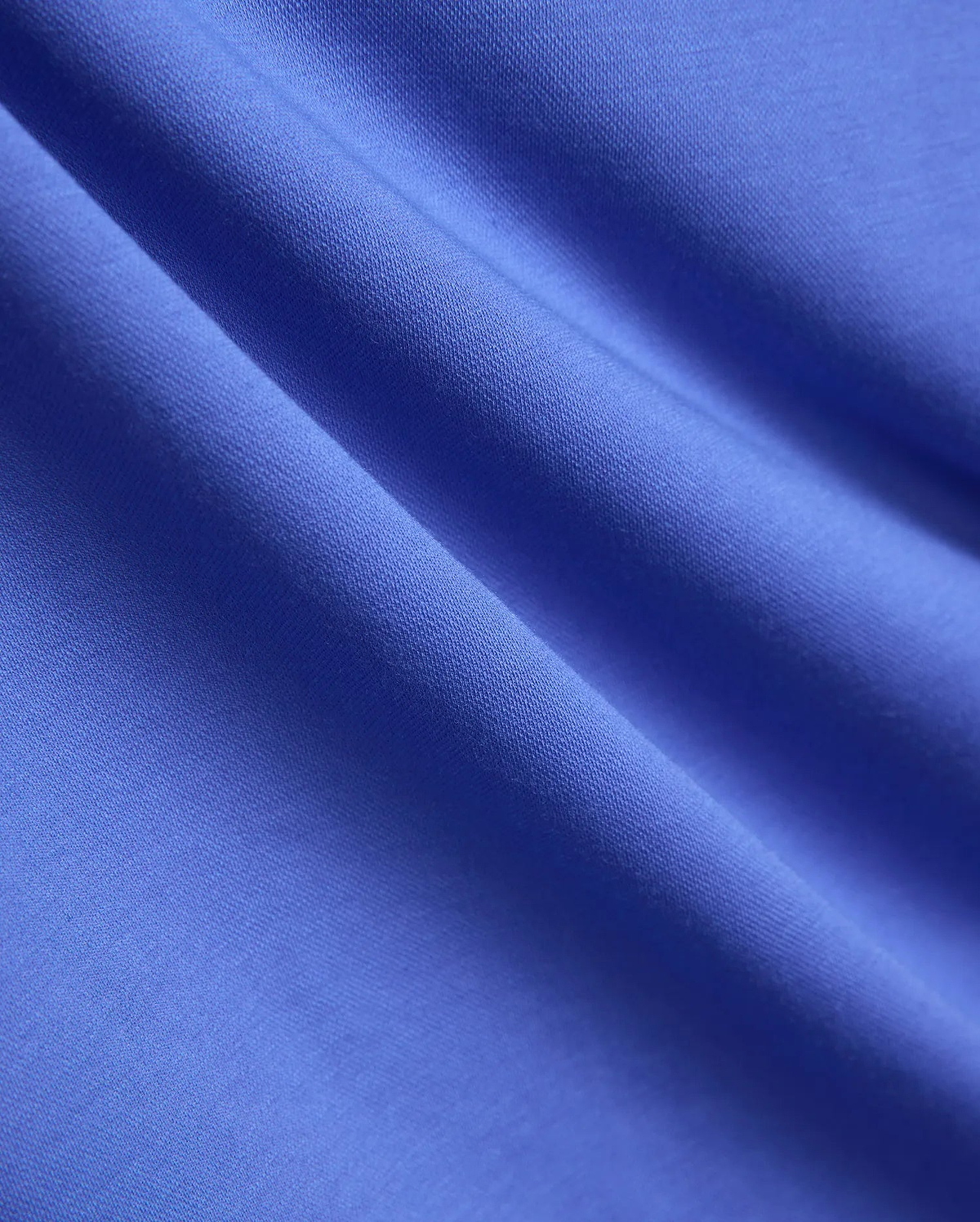 Mens Ridley Pique Polo in a vibrant royal blue, showcasing its refined, breathable pique knit fabric texture, embodying Psycho Bunny's premium streetwear style.