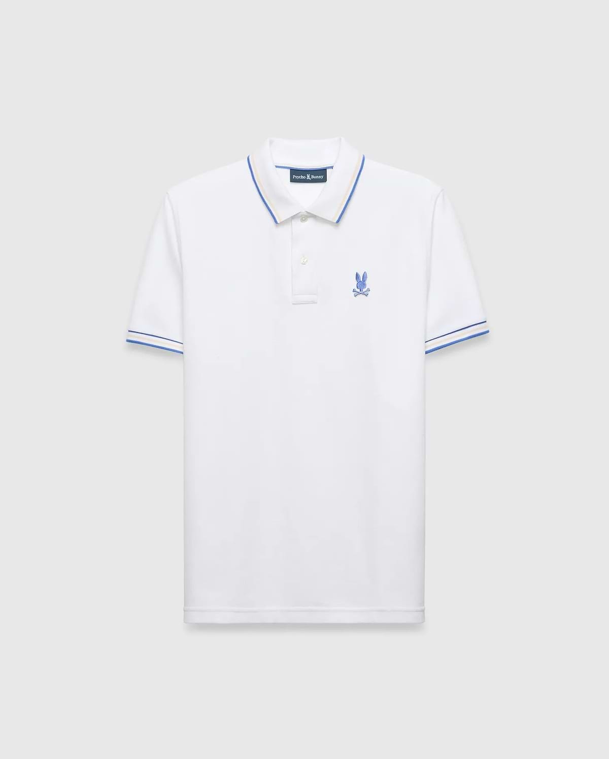 Mens Brad Pique Polo, white classic fit pique polo with blue and yellow tipping on collar and cuffs, featuring a small embroidered blue Psycho Bunny skull logo on the left chest. (5)
