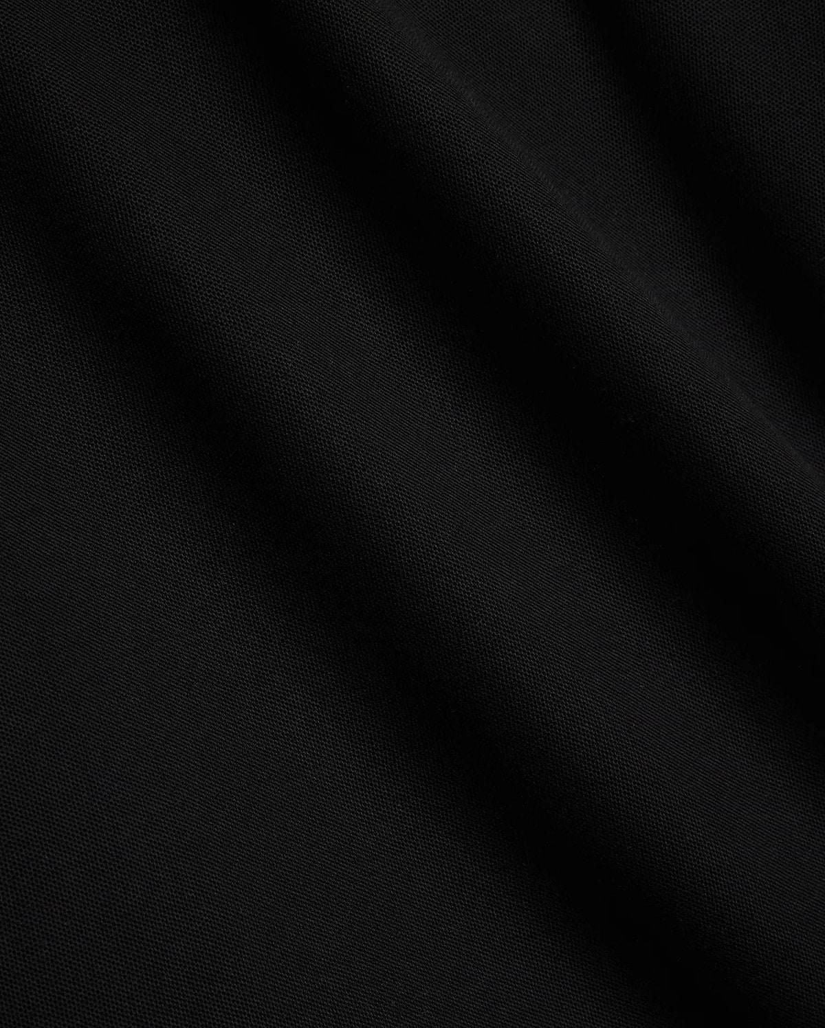 Mens Sunny Pique Polo, a premium black pique fabric polo shirt, detailed with the iconic small embroidered Psycho Bunny skull logo on the left chest.