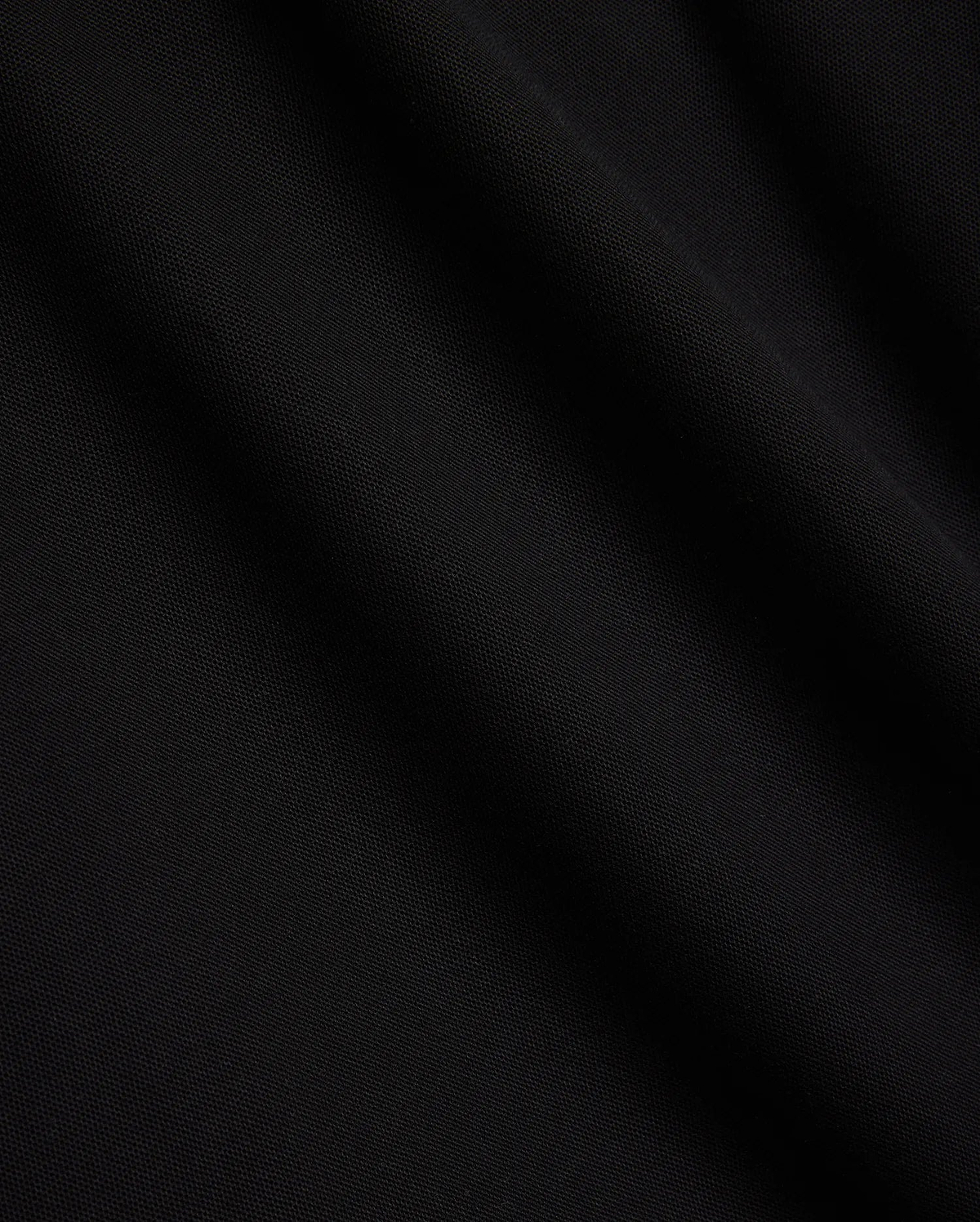 Mens Sunny Pique Polo, a premium black pique fabric polo shirt, detailed with the iconic small embroidered Psycho Bunny skull logo on the left chest.