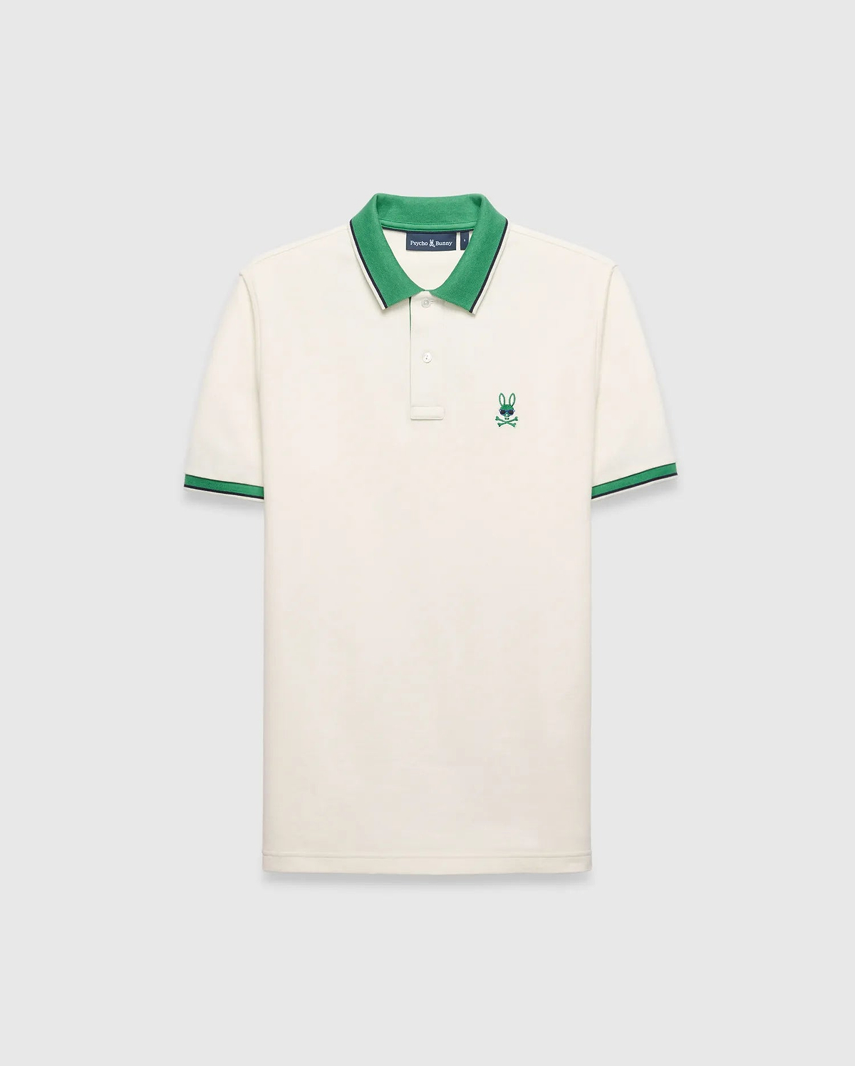 Mens Sunny Pique Polo, cream classic fit pique knit with a green collar and striped cuffs, featuring a small embroidered green Psycho Bunny skull logo on the left chest.