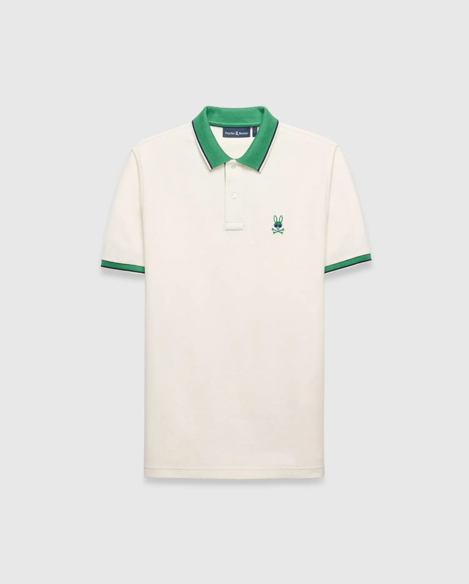 Mens Sunny Pique Polo, cream classic fit pique knit with a green collar and striped cuffs, featuring a small embroidered green Psycho Bunny skull logo on the left chest.