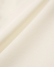 Mens Sunny Pique Polo in a rich cream hue, featuring a finely textured, breathable pique knit fabric, characteristic of Psycho Bunny's refined, comfortable menswear.