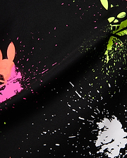 Mens Quintin Aop Pique Polo in black pique fabric, showcasing a bold all-over paint splatter print in neon pink, green, and white, with integrated Psycho Bunny skull logos.