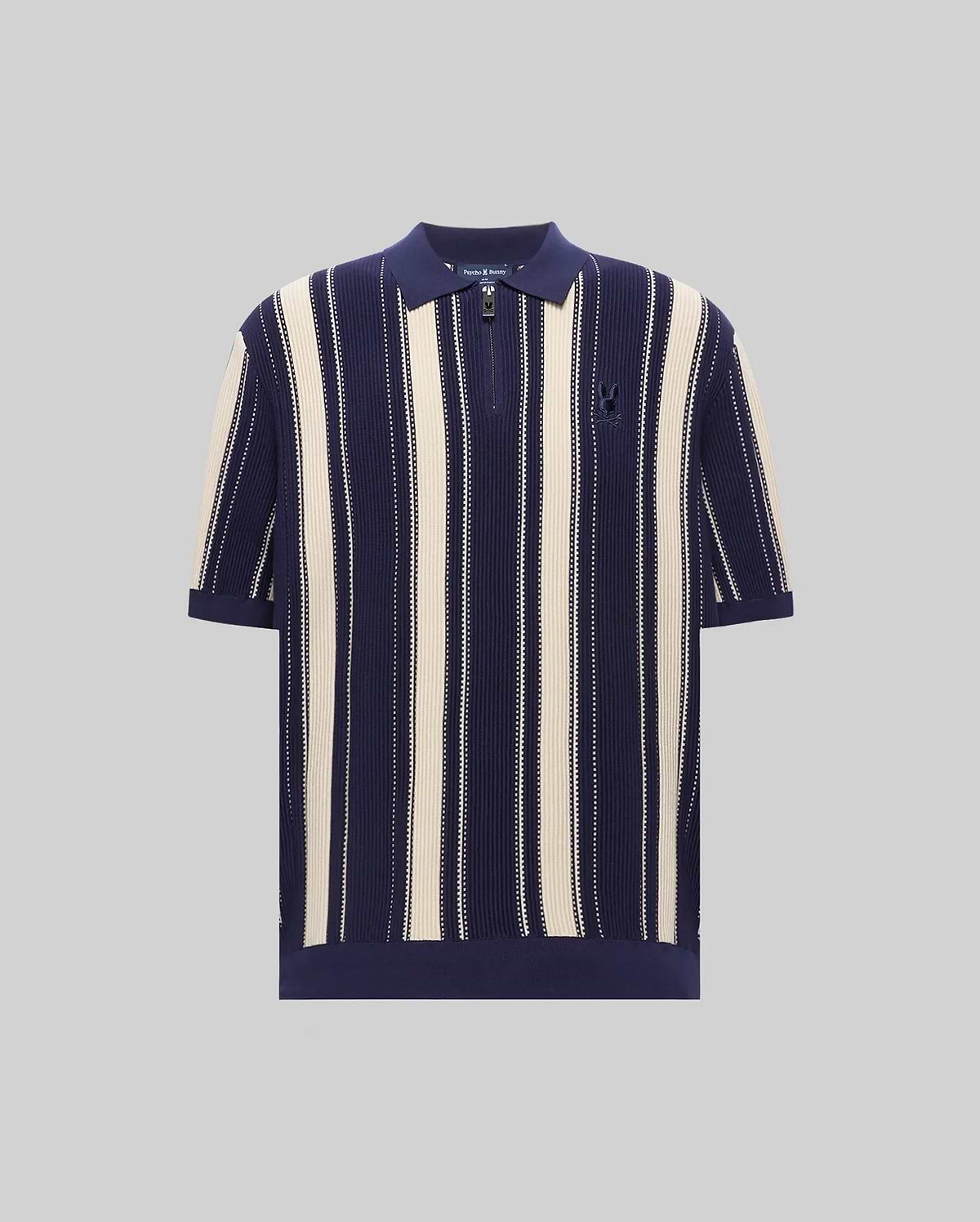 Mens Cliff Knit Zip Polo in navy and cream vertical stripes, featuring a relaxed fit, ribbed knit texture, quarter-zip placket, and a small embroidered Psycho Bunny skull logo on the left chest. (4)