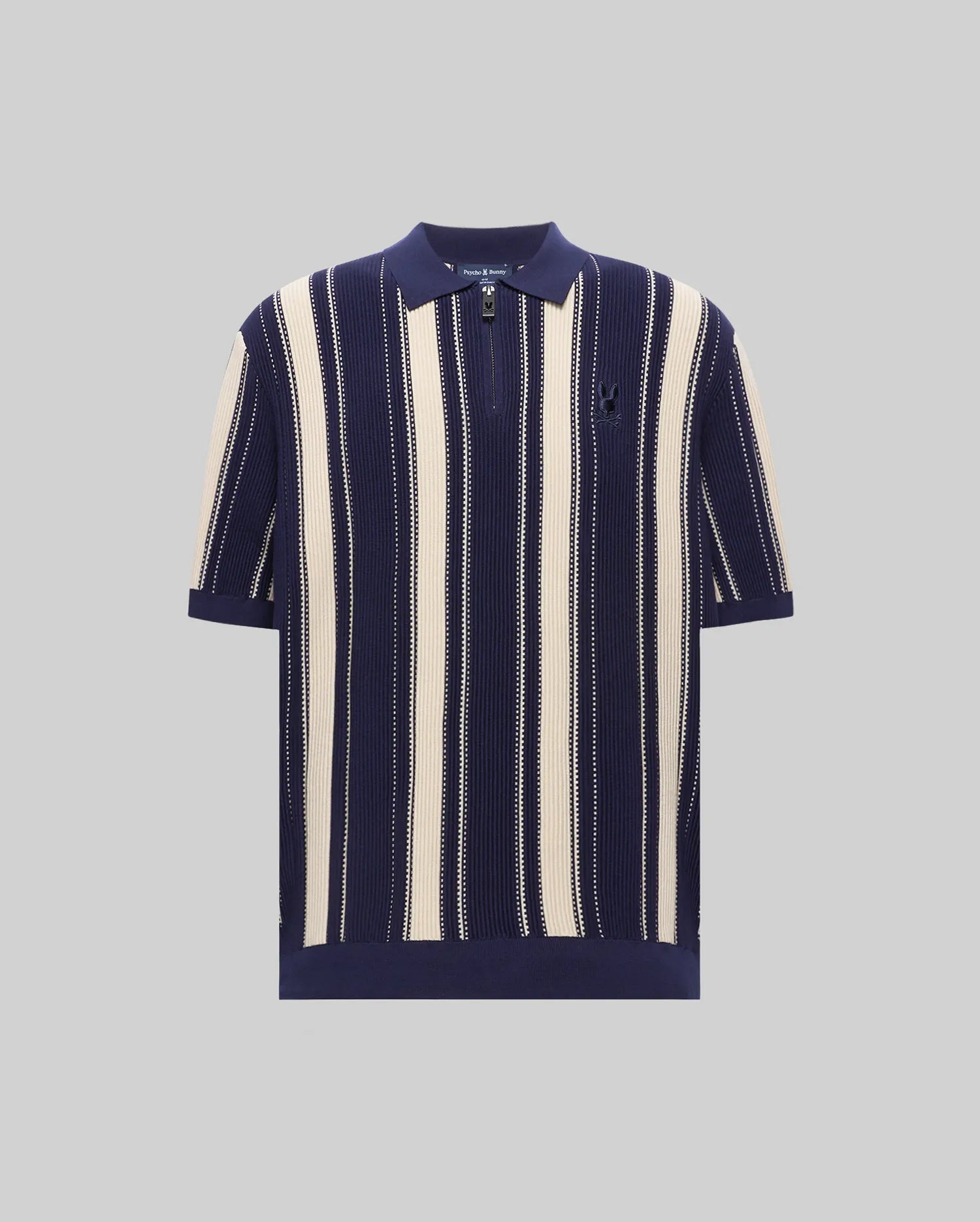 Mens Cliff Knit Zip Polo in navy and cream vertical stripes, featuring a relaxed fit, ribbed knit texture, quarter-zip placket, and a small embroidered Psycho Bunny skull logo on the left chest. (4)