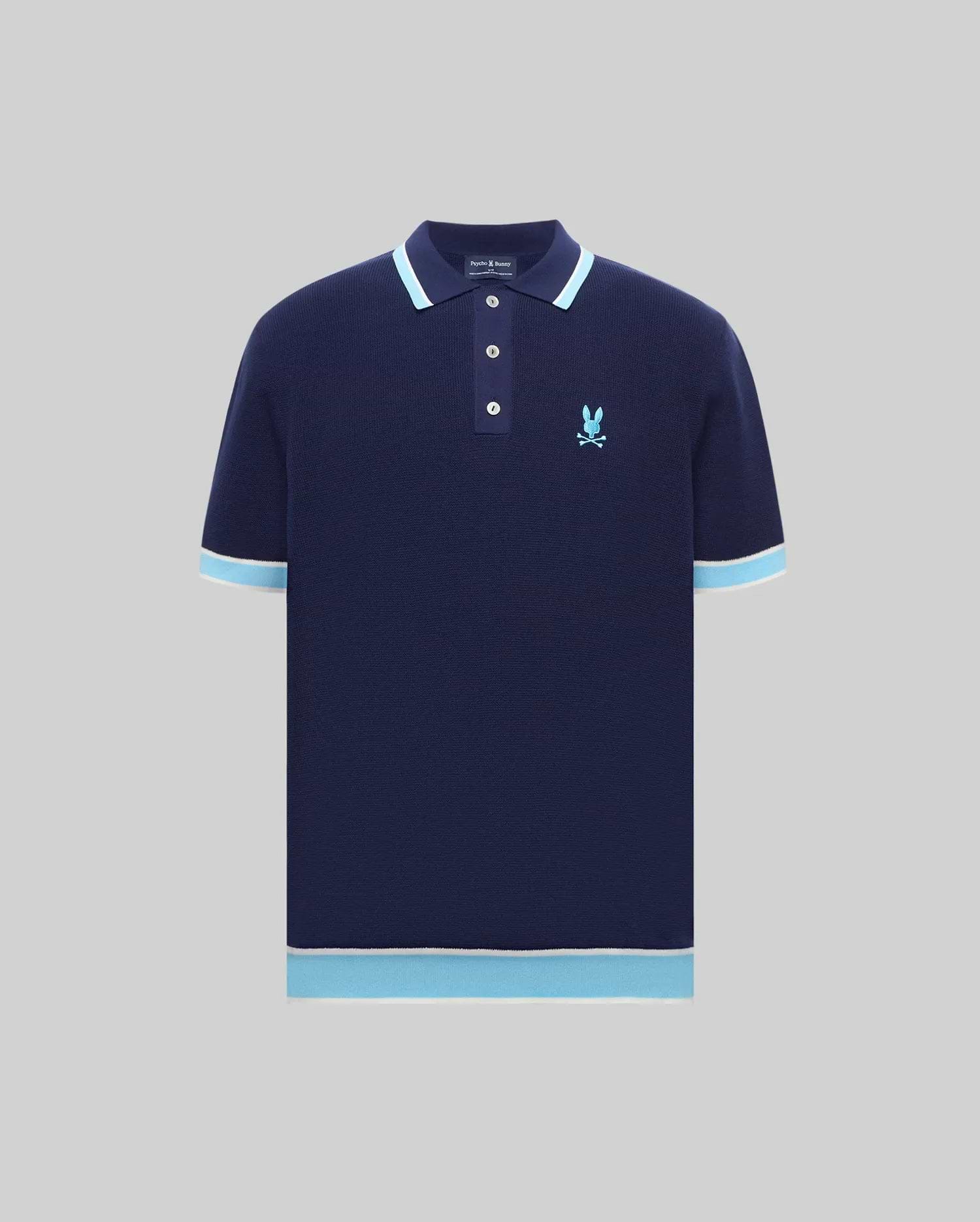 Mens Dax Knit Polo in navy knit with light blue and white tipped collar, cuffs, and hem, featuring an embroidered light blue Psycho Bunny skull logo on the left chest, classic fit. (4)