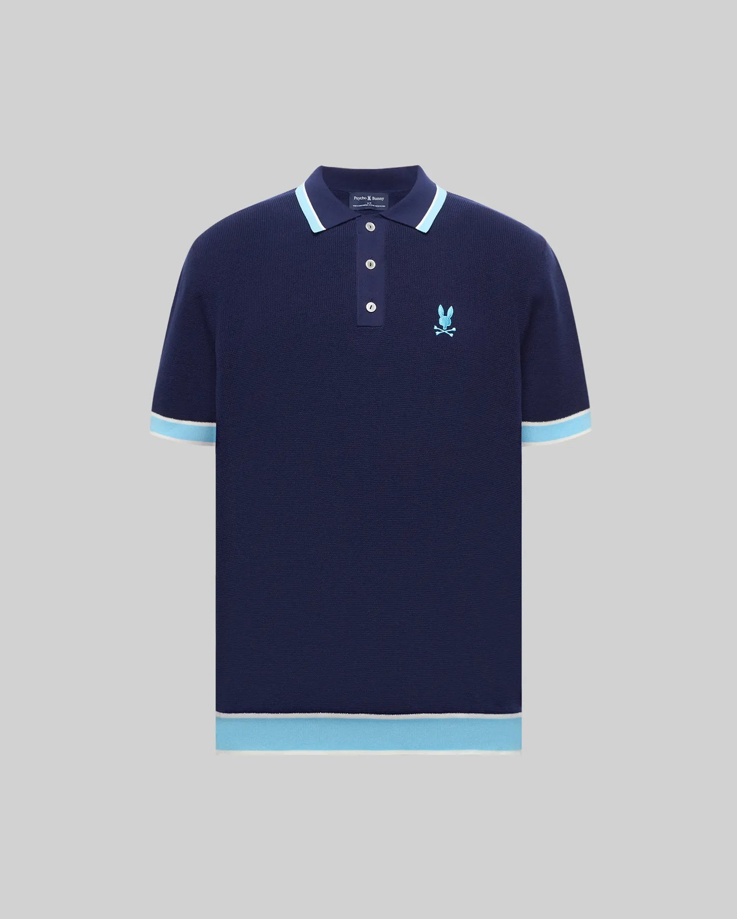 Mens Dax Knit Polo in navy knit with light blue and white tipped collar, cuffs, and hem, featuring an embroidered light blue Psycho Bunny skull logo on the left chest, classic fit. (4)