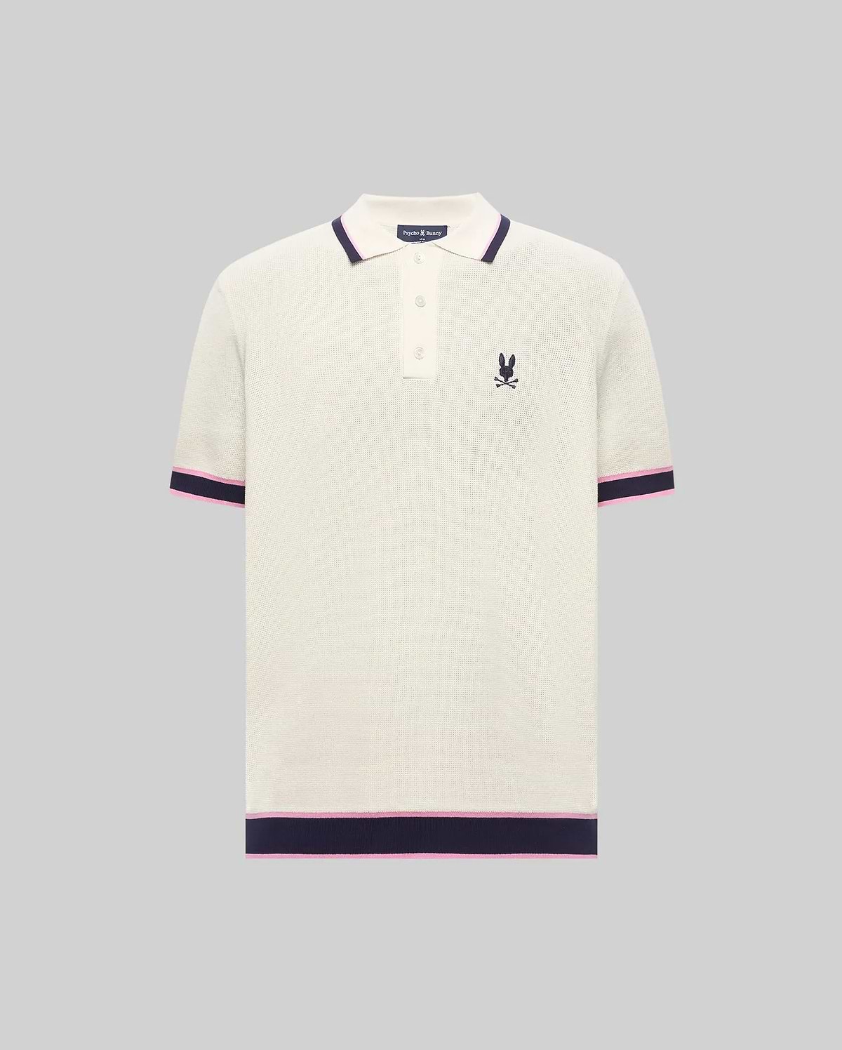 Mens Dax Knit Polo, cream textured knit with navy and pink striped ribbed collar, cuffs, and hem, featuring a small embroidered navy Psycho Bunny skull logo on the left chest.