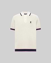 Mens Dax Knit Polo, cream textured knit with navy and pink striped ribbed collar, cuffs, and hem, featuring a small embroidered navy Psycho Bunny skull logo on the left chest.