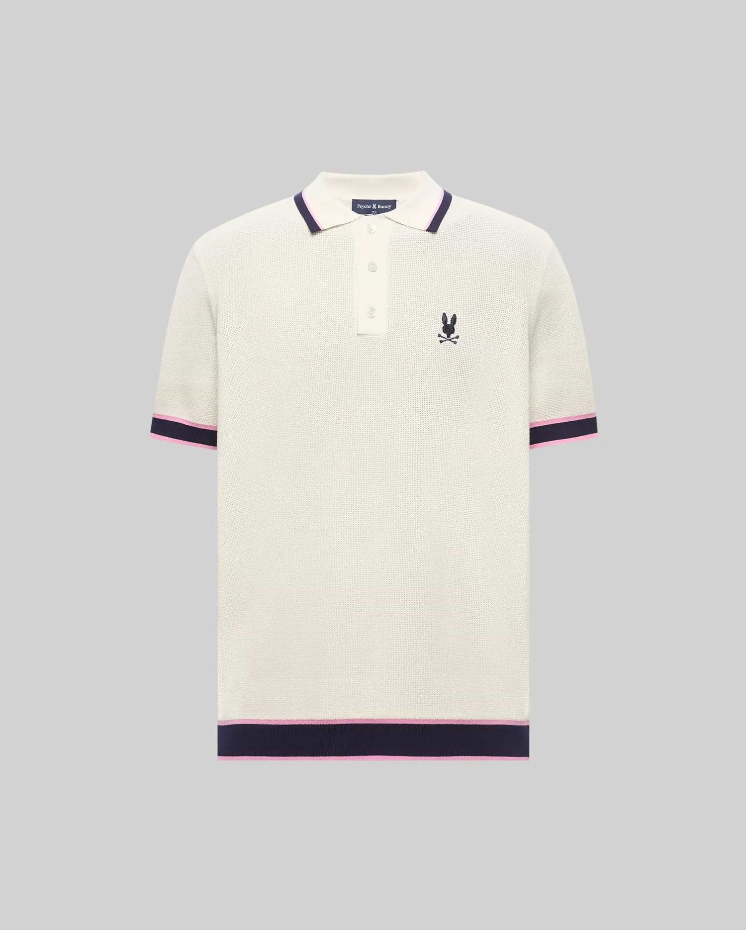 Mens Dax Knit Polo, cream textured knit with navy and pink striped ribbed collar, cuffs, and hem, featuring a small embroidered navy Psycho Bunny skull logo on the left chest.