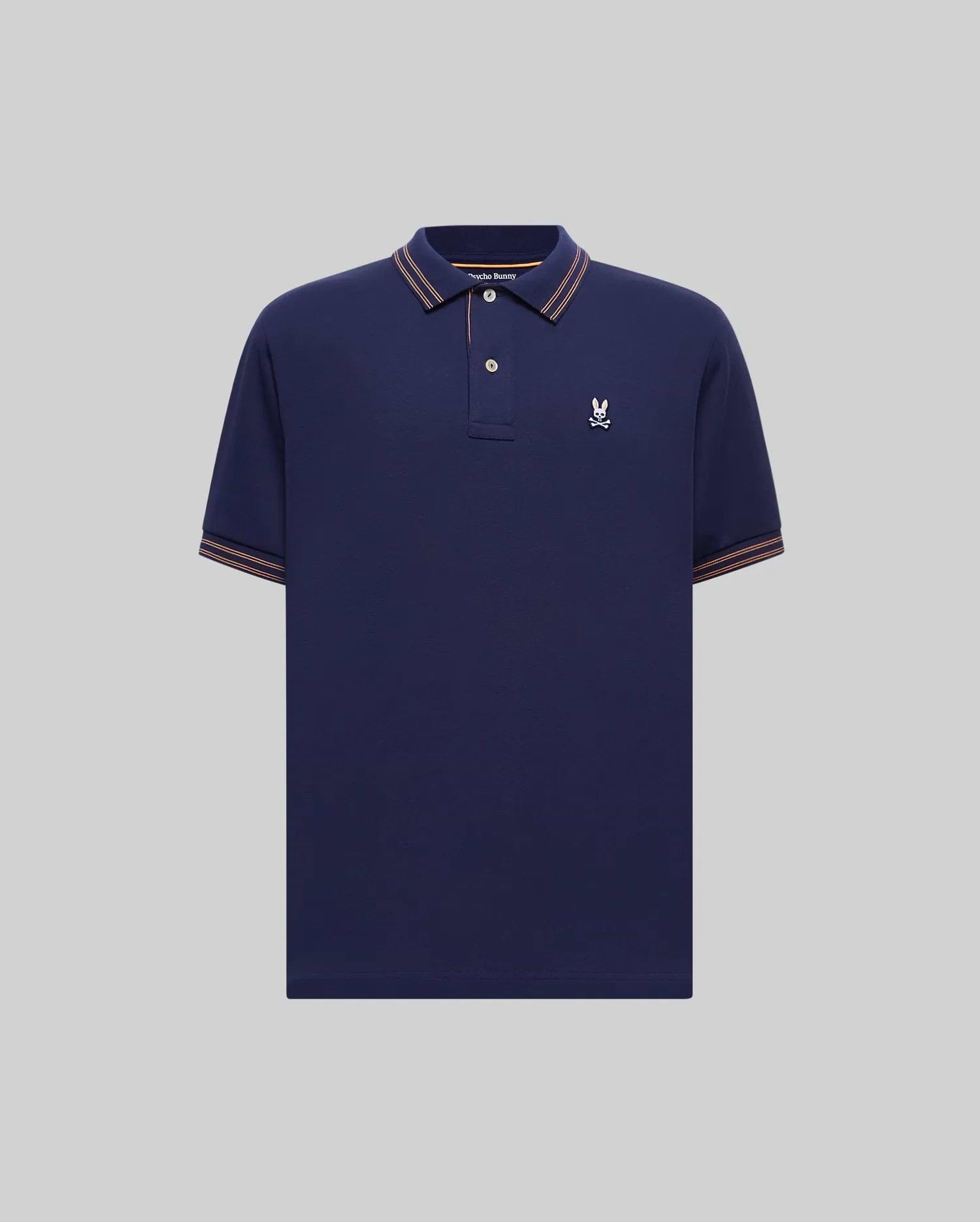 Mens Kenyon Lightweight Pique Polo in navy, featuring a classic fit, pique fabric, orange-brown and white striped collar and cuffs, and a small white embroidered Psycho Bunny skull logo on the left chest.