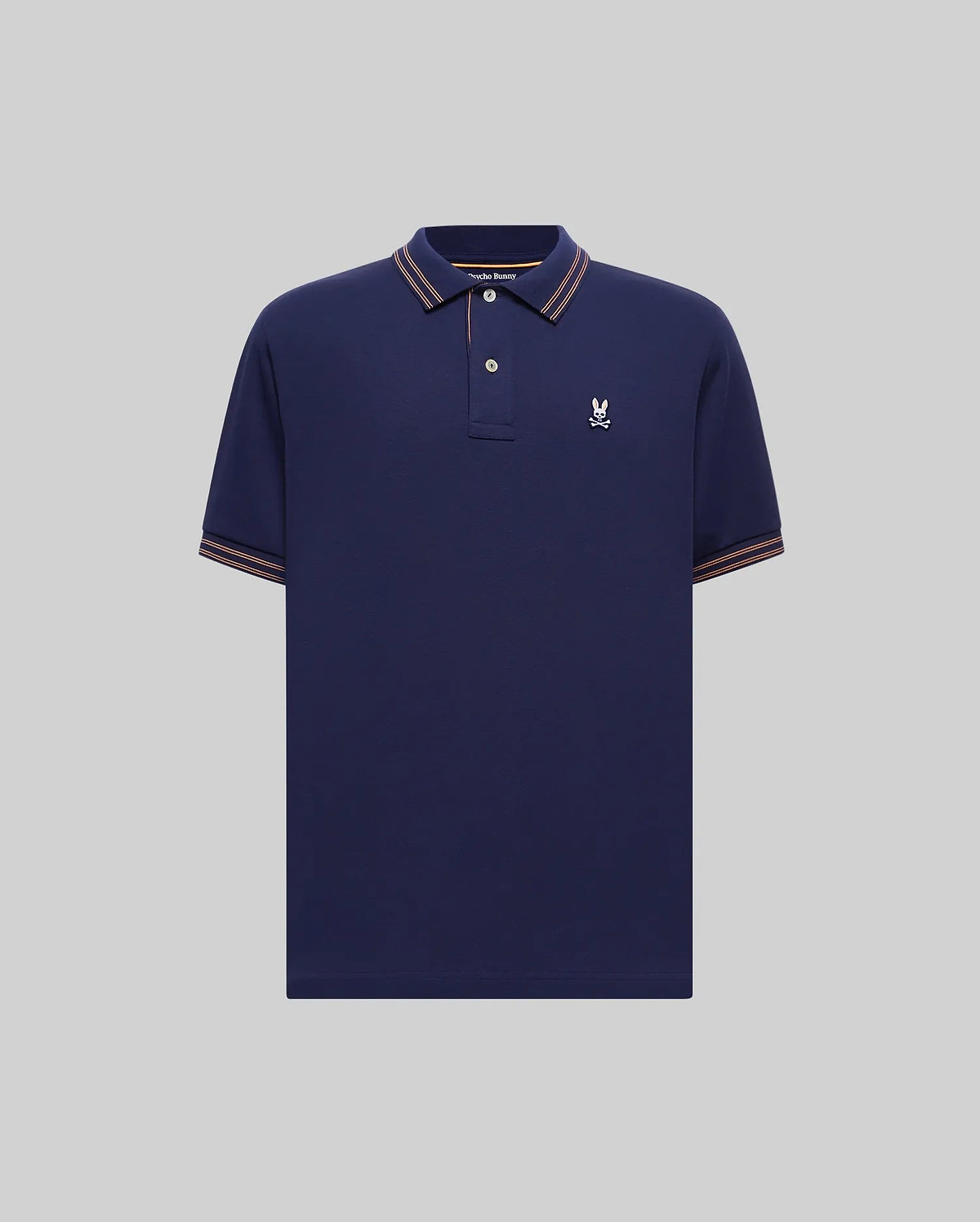 Mens Kenyon Lightweight Pique Polo in navy, featuring a classic fit, pique fabric, orange-brown and white striped collar and cuffs, and a small white embroidered Psycho Bunny skull logo on the left chest.