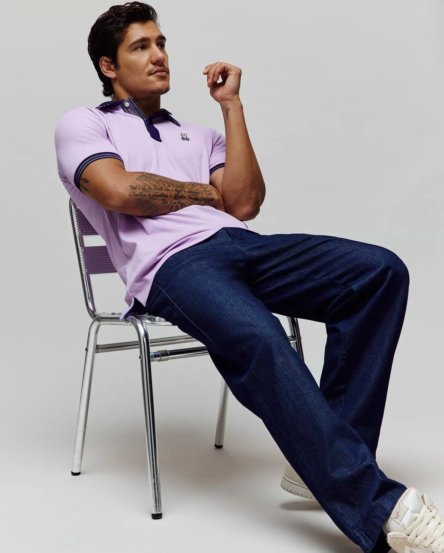 Mens Kenyon Lightweight Pique Polo in lavender, classic fit, with navy collar and striped cuffs, featuring a small embroidered Psycho Bunny skull logo on the left chest. (1)