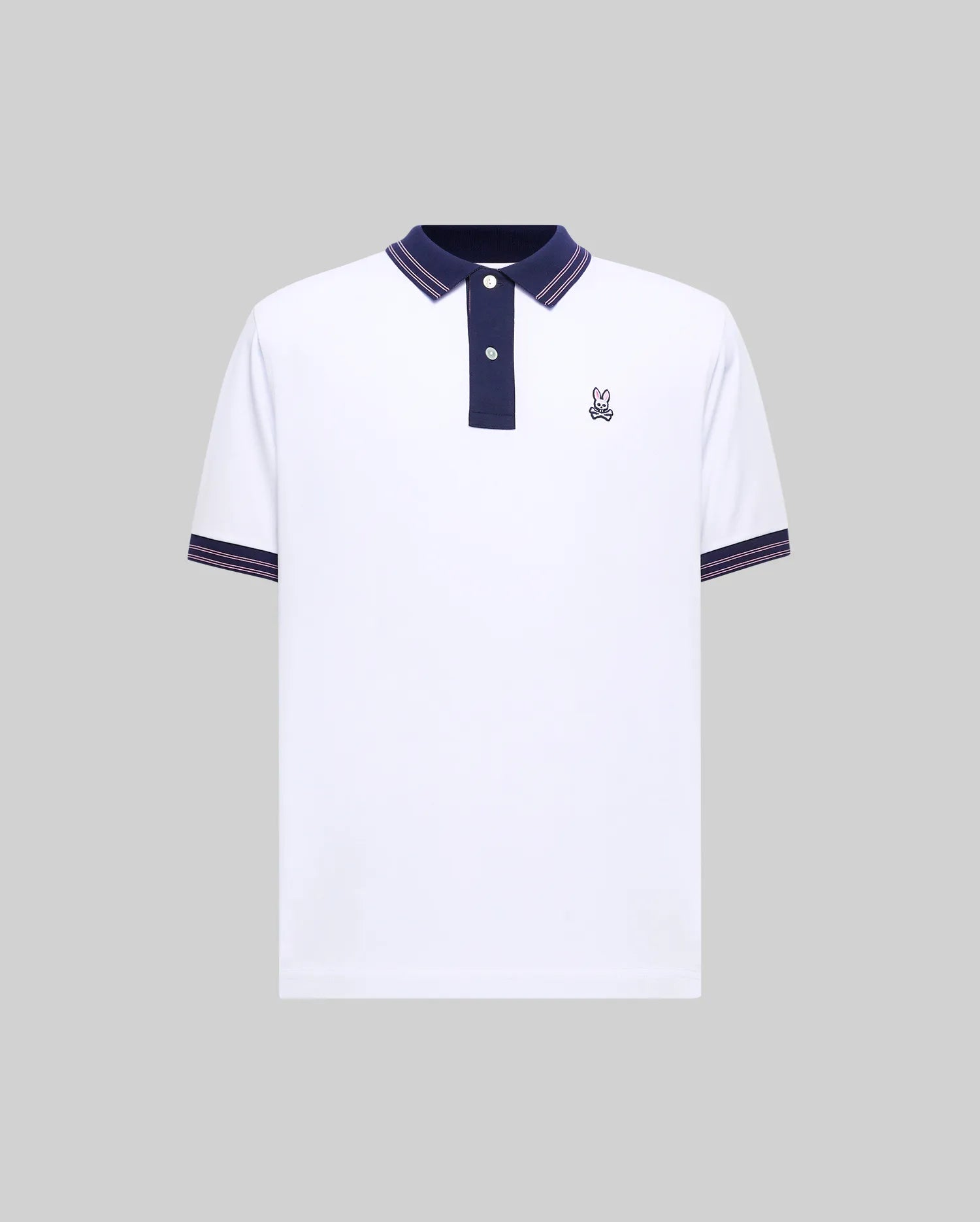 Mens Kenyon Lightweight Pique Polo, white with navy blue collar and placket, featuring pink striped tipping on collar and sleeve cuffs, and a small embroidered Psycho Bunny skull logo on the left chest.